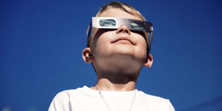 boy looking at solar eclipse