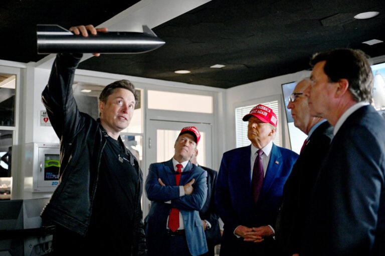 elon musk shows donald trump spacex starship model