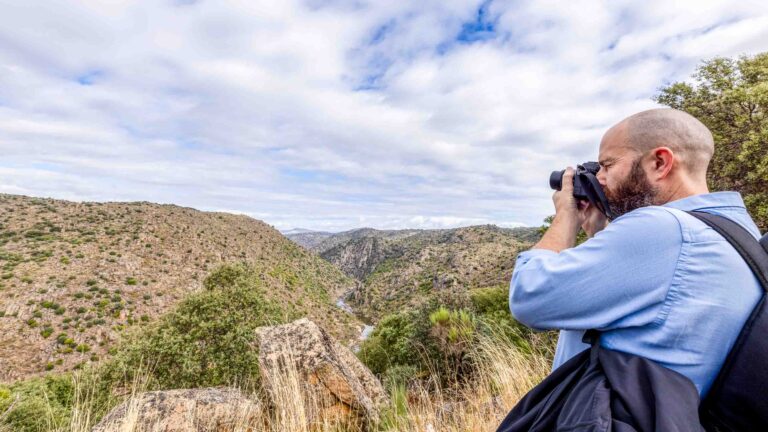 Hero Portugal Intrepid Diversify travel JD Murphy photographing birds in Faia Brava Reserve Photo Nori Jemil